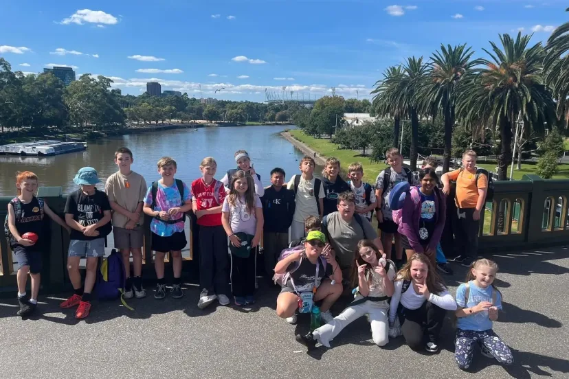 A camp group photograph beside the river